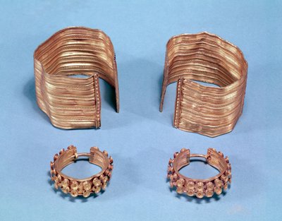 Two open facetted bracelets and a pair of earrings, from the princely tomb of Sainte-Colombe, Cote d